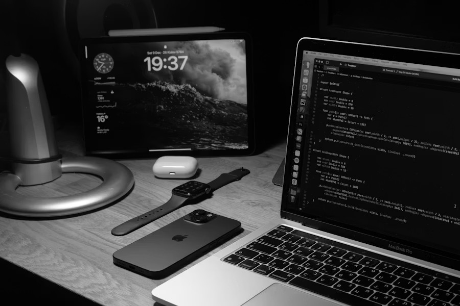 Developer workspace with laptop and code, representing BNTO web and software development